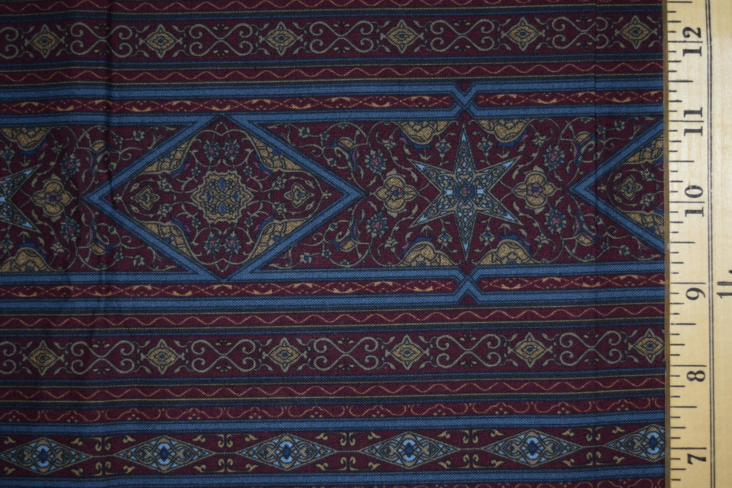 Jinny Beyer Border Print. Maroon, blue, and taupe border stripe in art nouveau style.